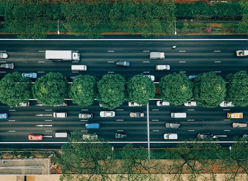 An aerial view of a divided 10 lane highway.