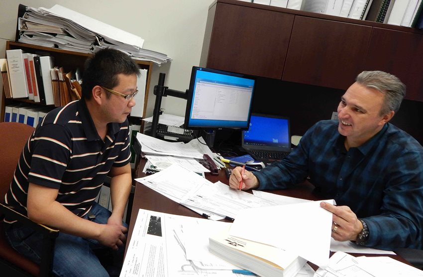 Rick Krutzler meeting and discussing a project while smiling